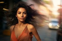 Portrait of a young woman in a busy city