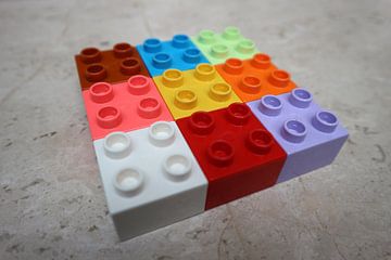 Nine (9) square toy blocks lying colourful (rotation 1)