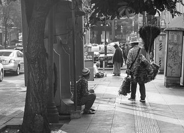 Two men in Bangkok are having a chat by Bart van Lier