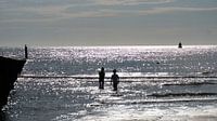 Brilliance in the sea with silhouette of children playing by Wendy Duchain thumbnail