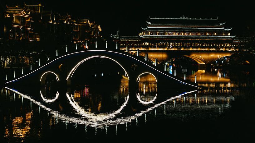 Atmospheric night view of Fenghuang Ancient Town, Hunan, China by Diederik De Mezel