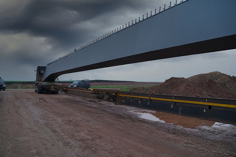 Arrival of heavy goods vehicles with bridge girders by Babetts Bildergalerie