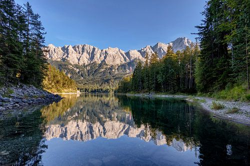 The Zugspitze massif is reflected in the Eibsee