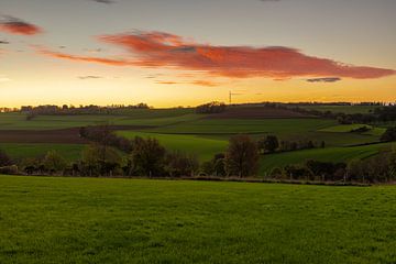 Colorful sunrise over wine estate Fromberg in southern Limburg by Kim Willems