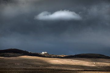 Landscape Lanzarote with a small white cloud by Harrie Muis
