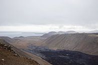 Volcanic landscape overlooking the sea in Iceland | Travel photography by Kelsey van den Bosch thumbnail