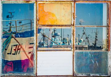 Window with reflection fishing boat by Ronald van de Steeg