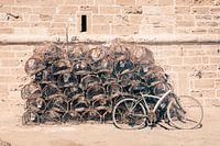 Still life of stacked lobster baskets with a bicycle