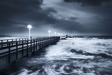 Winter storm at the pier of Scharbeutz at the Baltic Sea