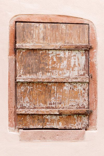 Wooden window in pastel pink wall | Travel photography wall art France by Milou van Ham