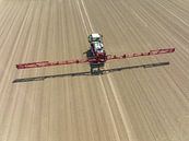 Agriculutural crops sprayer in a field seen from above by Sjoerd van der Wal Photography thumbnail