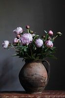 Peonies in old earthenware pot
