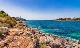 Idyllic view of the coast with lighthouse in Portocolom, Mallorca by Alex Winter