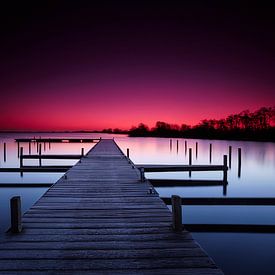 Empty wooden jetty in a quiet lake by Jef Folkerts