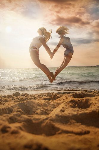 LP 71052617 Two Young Women Jumping in the Air, Mallorca Spain