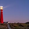 Lighthouse at Schiermonnikoog island in the dunes during sunset by Sjoerd van der Wal