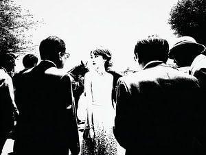 In the middle of the light – the girl and the whispering crowd