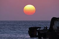 Zonsondergang bij scheepswrak