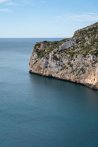 A cliff overlooking the calm sea