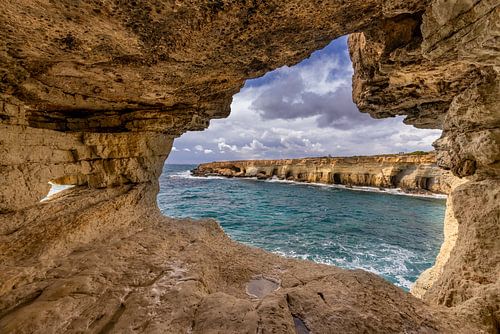 Cave with a view of the rocky coast