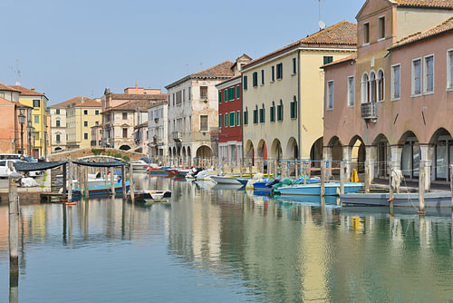 The Chioggia Canal with its colourful houses and boats at anchor