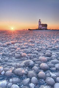 Marken lighthouse under winter conditions by John Leeninga