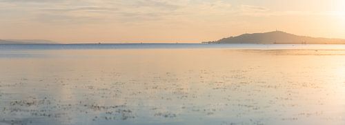 Panorama of Lake Balaton at sunrise with mountain in Fonyód