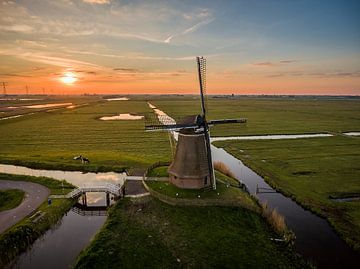 Windmill and sun by Hans Langenberg