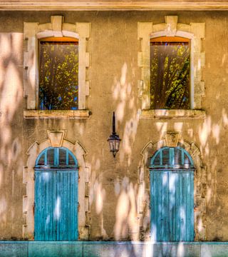 Two blue doors by Stewart Leiwakabessy