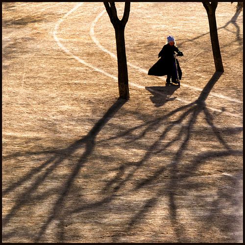 Little girl on a scooter on a winter's morning by Alain Ulmer