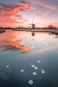 Mill in mirror at sunset with calm colors
