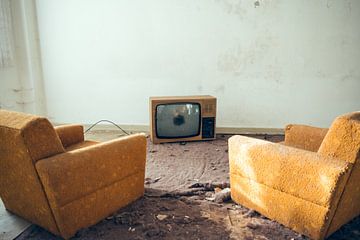old sofa armchairs with a cathode ray tube television set by Denny Gruner