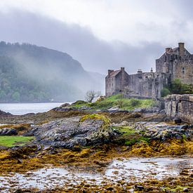 Einean Donan Castle and fog in Scotland by Rob IJsselstein