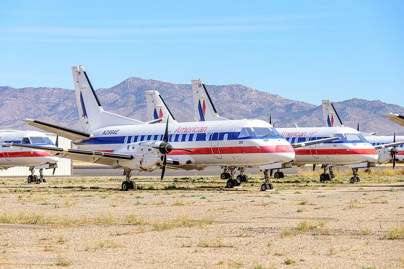 American Eagle Saab 340B stored in desert. by Jaap van den Berg