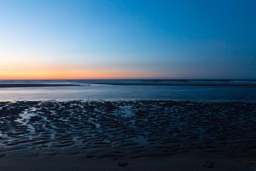 Zonsondergang op het strand van Rob Bergman