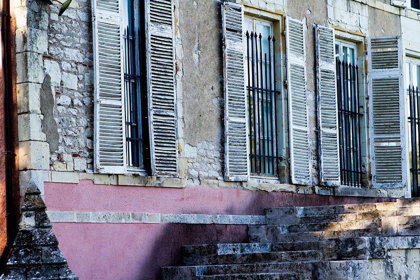 Windows with thief irons and shutters in an old castle facade by rene marcel originals