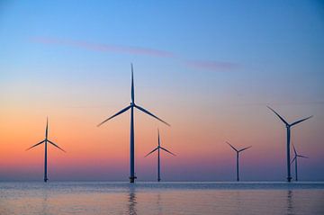 Wind turbines in an offshore wind park during sunset by Sjoerd van der Wal