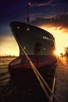 The ship Arklow with the sun behind it in Rotterdam harbour in the Netherlands