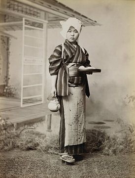 Portrait of a Japanese woman wearing kimono, "geta" sandals, holding a teapot. Vintage pho by Dina Dankers
