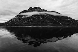 Black-and-white image of a dramatic mountain in Greenland by Martijn Smeets