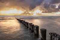 Threatening sky with breaking sun Ameland