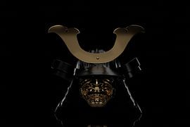 Ancient samurai helmet with maedate decoration in subdued light by Besa Art