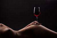Red wine on a woman body