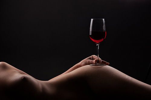 Red wine on a woman body by Leo van Valkenburg