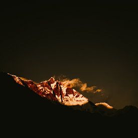 A Nepalese mountain top catches the last light by Moniek Kuipers