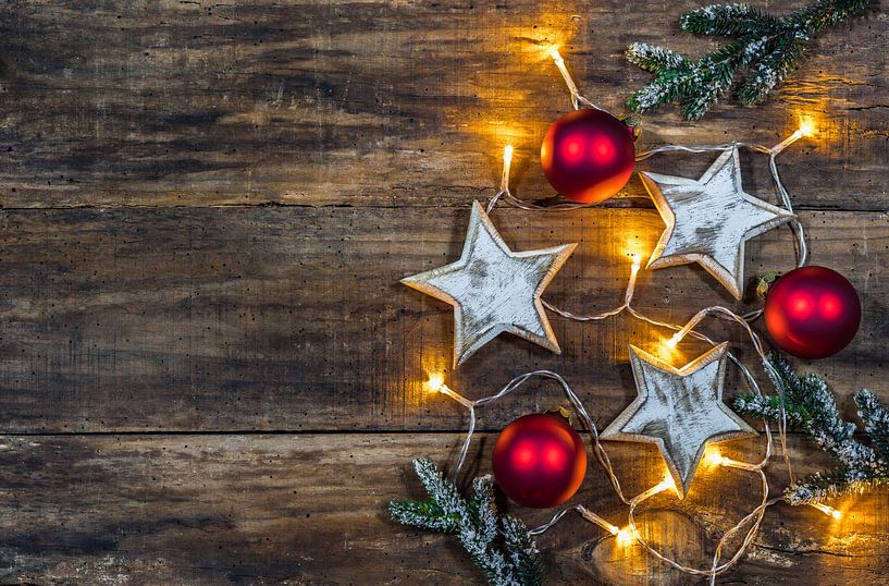 Christmas ornaments with fir branches and light by Alex Winter