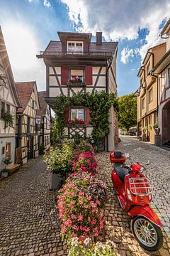 Half-timbered houses and Vespa in Gengenbach in the Black Forest by Werner Dieterich