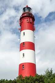 red white lighthouse on the north sea by Alexander Baumann