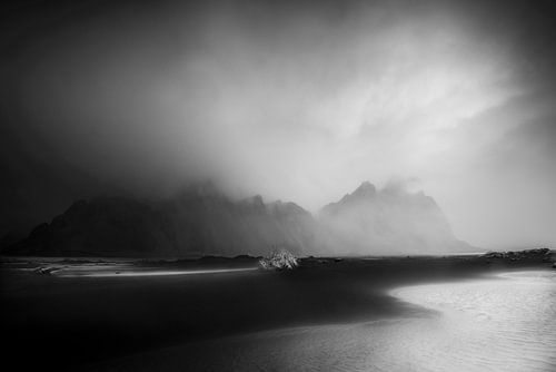 Beach by the sea in Iceland , black and white.