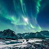 Northern Lights Aurora Borealis in the night sky over Northern Norway by Sjoerd van der Wal